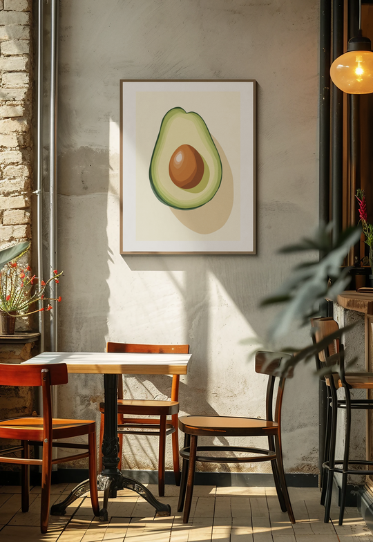 Dining area with wooden table and chairs, framed avocado artwork on the wall.