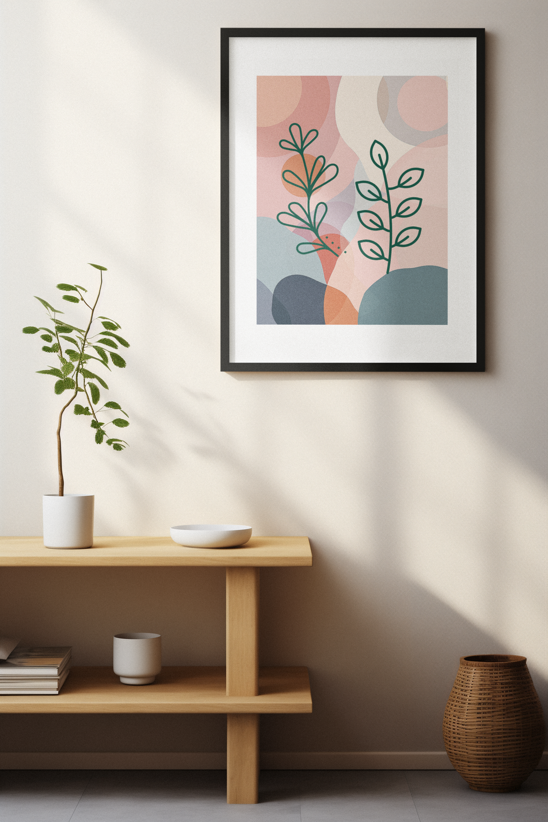 Framed abstract art print on a wall with a wooden shelf and decorative items below.