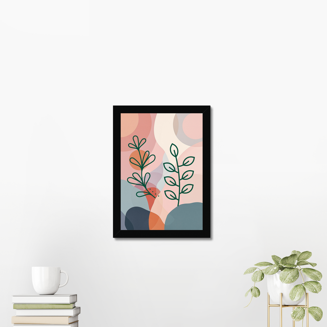 Framed abstract art print with plants on a white wall
