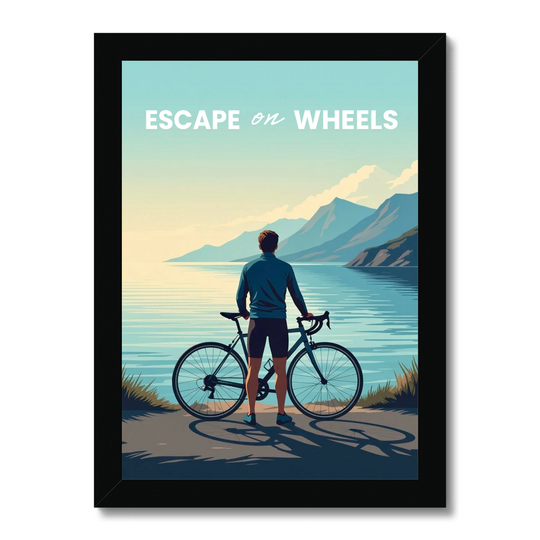 Framed poster of a cyclist by a lake with mountains in the background, featuring the text 'Escape on Wheels'.