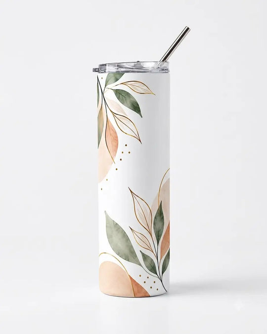 A tall, slim stainless steel tumbler with a clear lid and metal straw, decorated with a watercolor botanical pattern of green leaves and peach-colored abstract shapes on a white background.