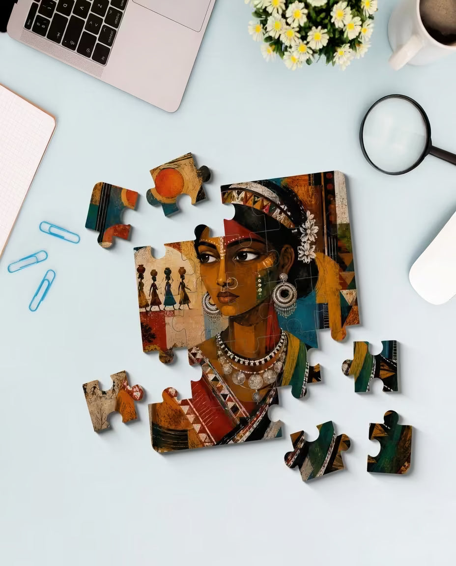 PrintLagoon jigsaw puzzle featuring a colorful folk art portrait of a Santhal woman in traditional dress with intricate silver jewelry, floral hair accents, and cultural face markings. Surrounded by geometric patterns, vibrant earthy colors, and illustrations of Santhal village life, this detailed artwork offers a unique and eye-catching puzzle experience for art and culture enthusiasts.