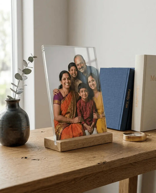 Printlagoon premium acrylic family photo frame on a natural wooden stand, crystal-clear personalized photo display for desks and shelves.