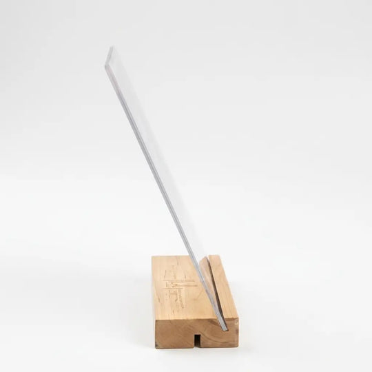 Side view of a premium 3mm crystal-clear acrylic photo frame with a sturdy wooden stand by printlagoon.
