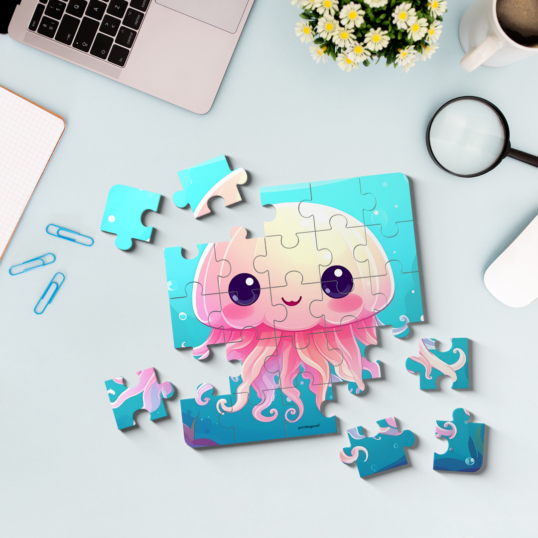 Jellyfish-themed puzzle on a desk with a laptop, flowers, and magnifying glass.