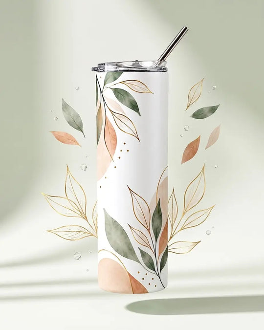 White skinny tumbler with a clear lid and metal straw, decorated with watercolor sage-green and blush-peach leaves, gold line-art foliage and small gold dots, floating against a soft sage background with leaves and water droplets around it. personalised by printlagoon