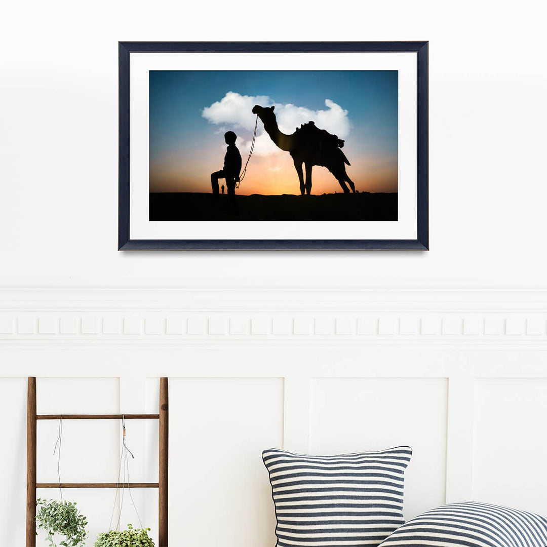 Silhouette of Camel and Boy