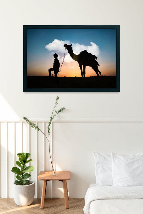 Silhouette of Camel and Boy