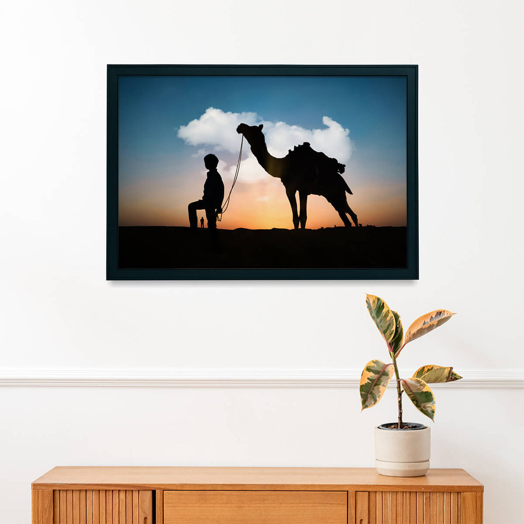 Silhouette of Camel and Boy