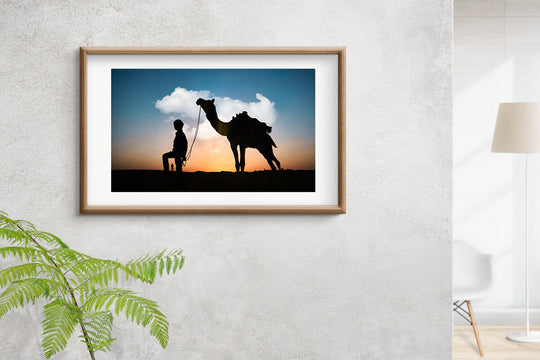 Silhouette of Camel and Boy